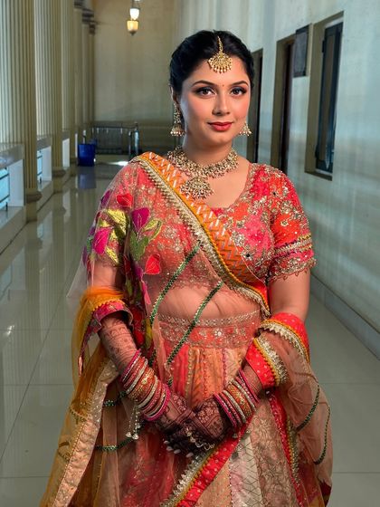 The full look for the Raas-Garba night. The bride looks radiant and ready to celebrate in her traditional Gujarati attire and glowing makeup.