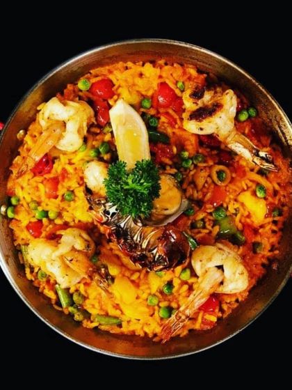 A classic seafood paella, brimming with prawns, mussels, and lobster. This dish is a true celebration of Spanish coastal cuisine.