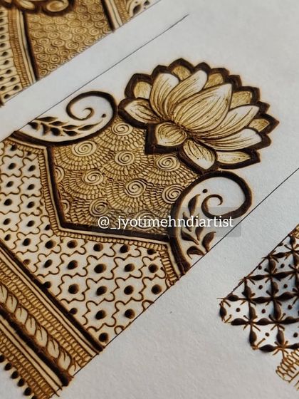 A close-up of the lotus startup pattern, showing the delicate shading and spiral fills.