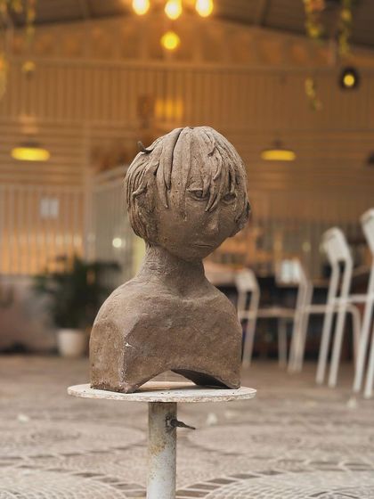Another angle of the stylized bust, showing the thoughtful and melancholic expression captured by the artist.