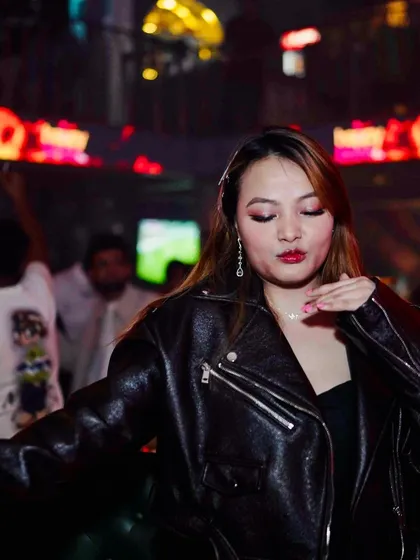 A guest in a leather jacket looking cool and confident at Happy Brew.
