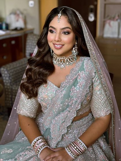 A closer view of the soft glam makeup for a phera ceremony. The pastel lehenga is beautifully complemented by the fresh, dewy skin and soft eye makeup.