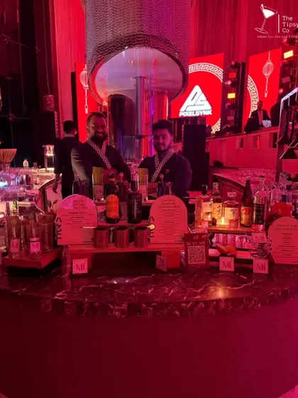For a Japanese-themed event, we designed this circular bar with dramatic red lighting and custom menu stands. Our bartenders even wore themed attire to complete the immersive experience.