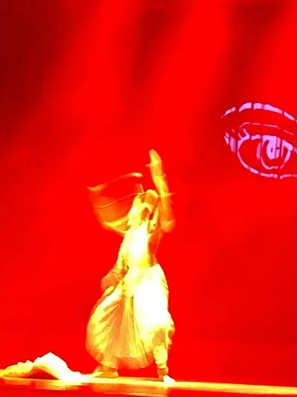 A powerful moment from "Sharad" where I perform a fiery dance in obeisance to Devi, connecting the autumn season to the festival of Navaratri and Durga Puja. The red lighting and digital projections amplify the energy.