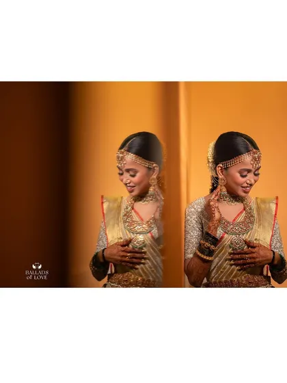 A duplicate of image 100, a creative shot of a bride's reflection in her stunning gold saree and custom blouse.