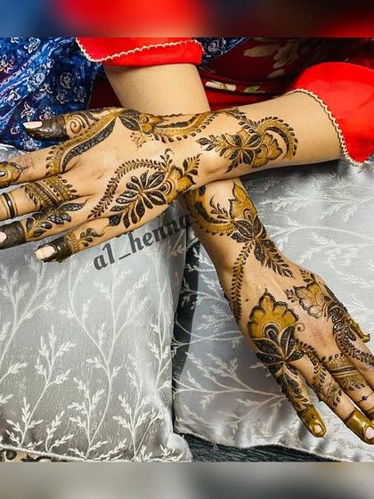 A pair of hands with a matching bold floral design, ideal for a coordinated look.