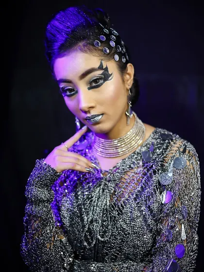 A portrait of the futuristic glam look, demonstrating how to combine edgy makeup with a high-fashion aesthetic.