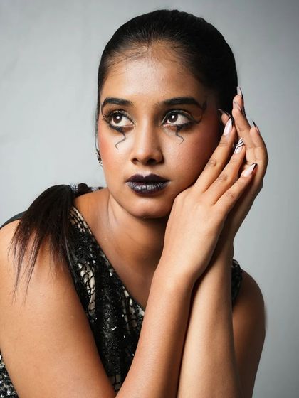An expressive shot capturing the mood of this gothic-inspired makeup look, showing our students' ability to create art and tell a story.