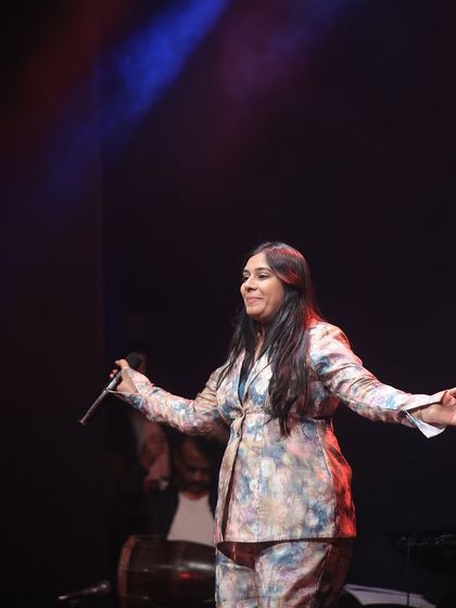 A candid shot of me on stage, lost in the music. There is no greater feeling than connecting with the audience through a song.