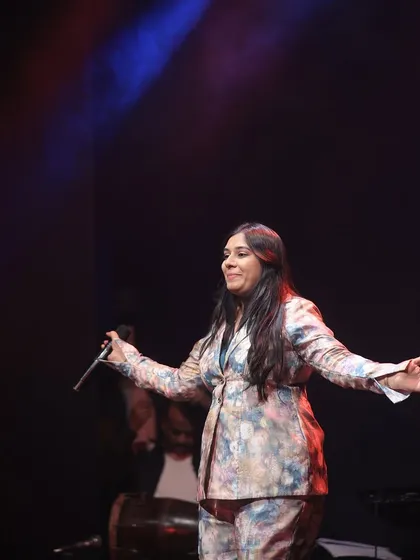 A candid shot of me on stage, lost in the music. There is no greater feeling than connecting with the audience through a song.