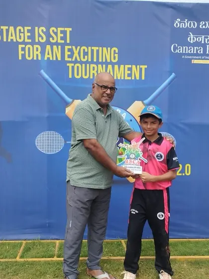 A young player receives an award at the Canara Bank Premier League, one of the many tournaments our players participate in.