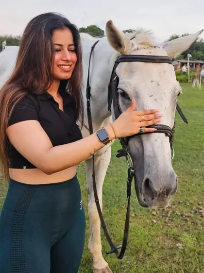 A gentle pat and a happy smile. We encourage our riders to spend time bonding with their horses.