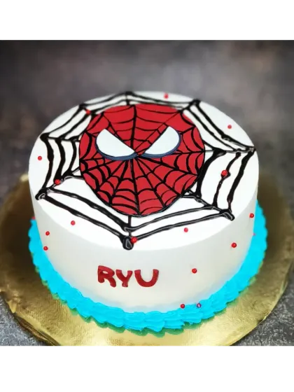A minimalist Spiderman cake with a focus on the iconic mask. This is a choco-vanilla flavor with clean lines and bold colors.