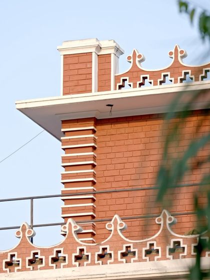A close-up of the home's historic brickwork and parapet detailing. We took great care to preserve these original architectural elements, which tell the story of the home's pre-independence origins.