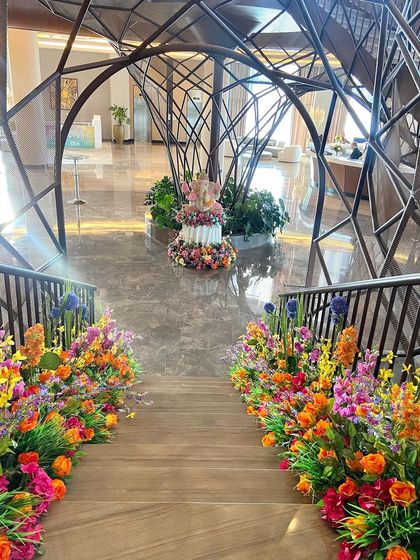The staircase at a destination wedding in Bodrum, Turkey, which we styled with a 'bubblegum' palette of vibrant florals, inspired by the MET Gala's garden theme.