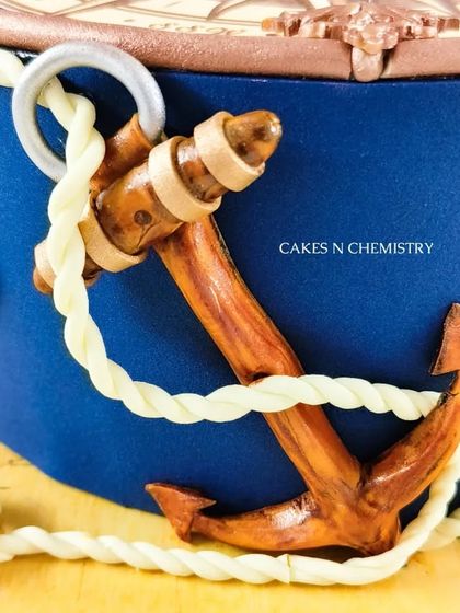 A close-up of the hand-modelled anchor from the nautical cake. I painted it with edible colours to give it a realistic, weathered wood texture, showing the level of detail I put into my work.