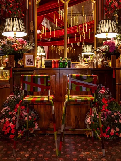 A creative detail shot of the custom-wrapped bar stools, adding a pop of color and pattern to the bar area.