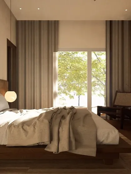 Natural light floods this Japandi-themed bedroom, creating a bright and airy feel. The design uses a simple material palette of wood and linen to evoke a sense of peace and tranquility.