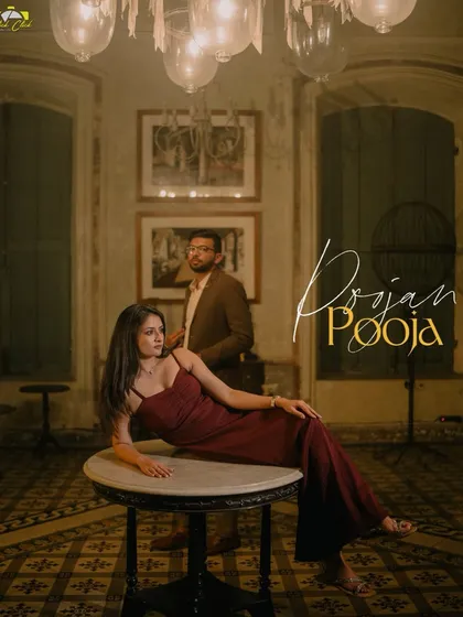 A full-length shot showcasing the couple's elegant styling and the grandeur of their Pondicherry location. The composition is bold and artistic.
