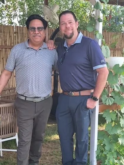 A visiting PGA Pro, Mathew Reise, poses with a member of our team, sharing knowledge and enthusiasm for the growth of golf in India.