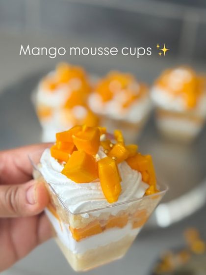 A close-up of our seasonal Mango Mousse cups. We use fresh, sweet mangoes to create these delicious summer treats.