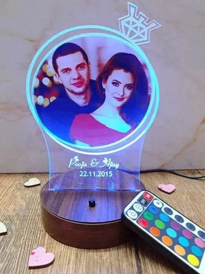 This custom LED photo lamp is a perfect gift for anniversaries or birthdays. I can engrave your names and a special date below your favorite photo, and you can change the light color with the included remote to match any mood.