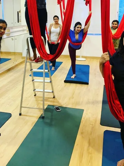 A wonderful group of women getting ready to fly in an aerial yoga class. The energy in the studio is always so supportive and encouraging, especially when trying something new together.