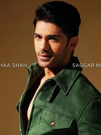 The combination of Taaha Shah's strong presence and the jacket's sharp tailoring creates a look of timeless elegance.