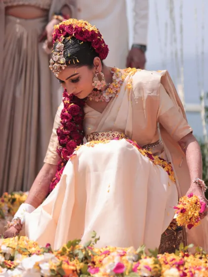 A candid shot of the bride during her Haldi ceremony. Her makeup is soft and radiant, allowing her to look and feel beautiful during the rituals.