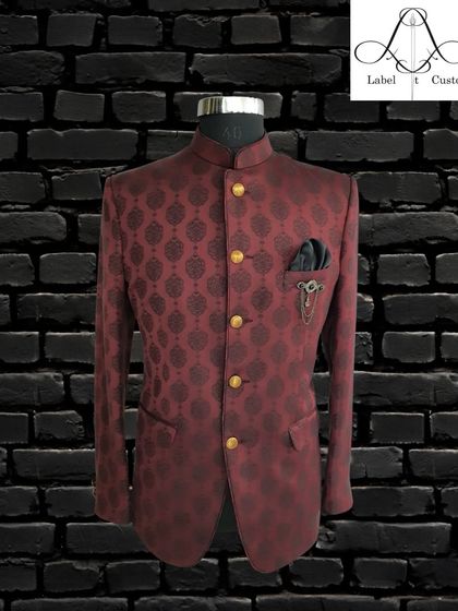 A deep maroon bandhgala with a subtle, dark damask pattern. This piece is all about understated luxury, perfect for a gentleman who appreciates fine tailoring and classic design.