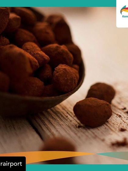 A bowl of our chocolate-dusted almond dragees. This simple, elegant shot highlights the texture and richness of one of our most popular confections.