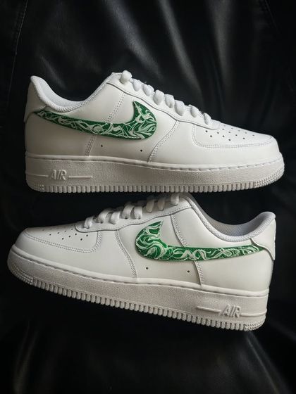 A pair shot of the green paisley custom sneakers.