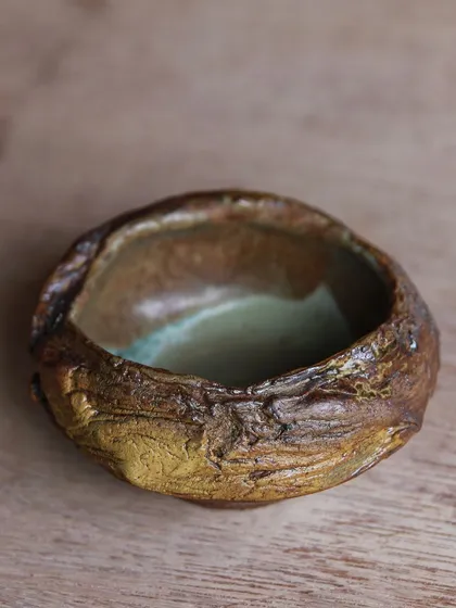 This small, hand-built bowl has a wonderfully tactile surface. It's a piece that begs to be held and examined closely.