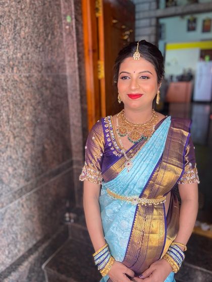 The final look, ready for the ceremony. The makeup, hair, and traditional attire all came together to create a timeless and elegant style for the mom-to-be.