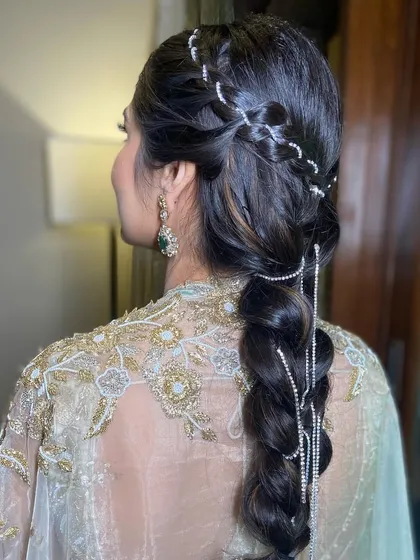 A side view of the diamond chain braid, showing how the accessories are woven into the hair for a cascading effect.