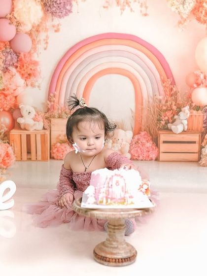 A quiet moment of contemplation before the cake smashing continues. I capture a range of emotions during these sessions, from excitement to curiosity.