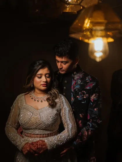 An artistic and moody portrait of a couple during their engagement event. I use creative lighting to set a romantic tone and create images that feel like a scene from a movie.