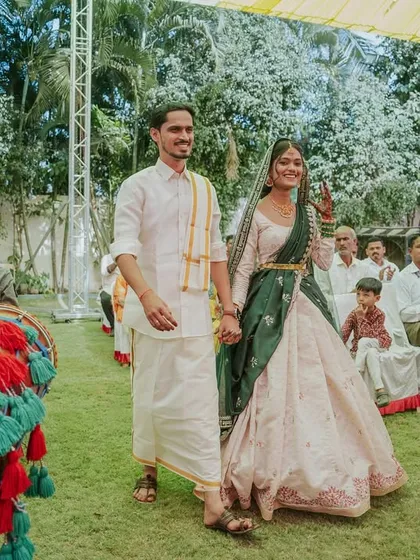 The couple's grand entrance to the Haldi ceremony, accompanied by dhol players, setting an energetic tone for the event.