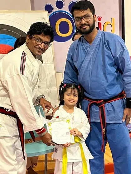 Progression is a core part of the karate journey. A proud moment as one of our youngest students receives her certificate and new belt during a grading examination, marking a successful step forward in her martial arts development.