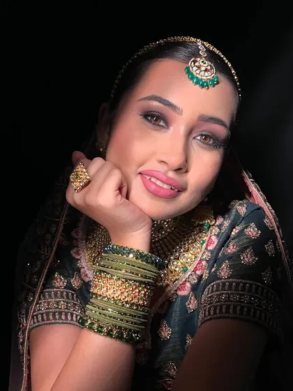 A beautiful smile from a bride-to-be. This look, created during an advanced workshop, features soft smokey eyes and a natural pink lip, perfect for a modern bride.