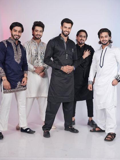 A group showcasing the variety within my Pathani and kurta collections. From classic black and white to detailed embroidery, each man expresses his individual style.