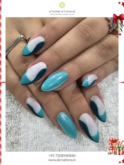 Inspired by ocean waves, this design features flowing abstract shapes in teal, dark blue, and white on glossy almond nails. It's a modern and artistic take on nail art.