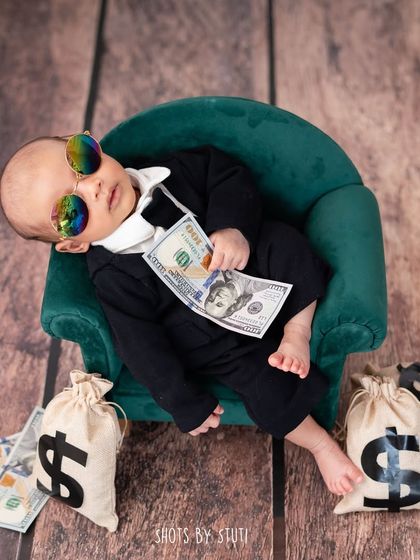 Introducing the Boss Baby. This creative newborn theme is full of attitude and fun, with a tiny suit, sunglasses, and bags of money.