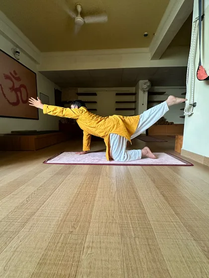 The Balancing Table Pose, or Dandayamana Bharmanasana, is excellent for stabilizing the core and improving digestion. It creates a gentle massage for the abdominal organs, aiding in the detoxification process.