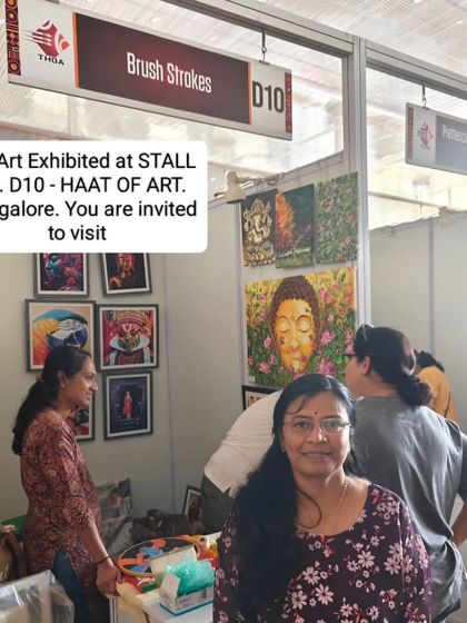 A photo from my stall at the HAAT OF ART, surrounded by my paintings. I love inviting people to come and see my work in person.