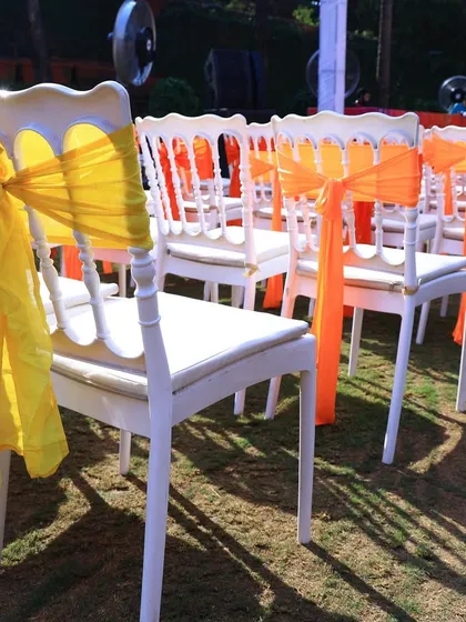 Simple details like colorful organza ribbons on chairs can tie the whole decor theme together beautifully.