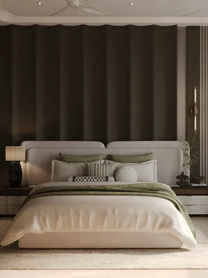 This bedroom is an ode to layered luxury. A dark, scalloped wall serves as a dramatic headboard, contrasting with the soft, light-colored bed. The design feels both indulgent and deeply comforting.