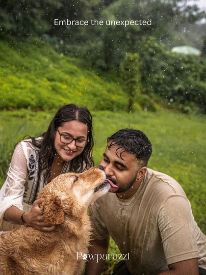 Embracing the unexpected. A golden retriever gives his dad a big, wet kiss in the middle of a downpour, a perfect memory of a spontaneous moment.