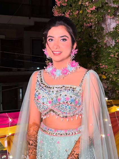 The complete look for Surbhi's Mehendi. The light, dewy makeup ensures she looks radiant and feels comfortable.