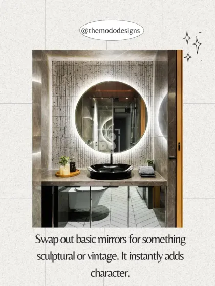 Swap out basic mirrors for something sculptural or vintage. A unique mirror, like this backlit round one, instantly adds character and becomes a focal point.